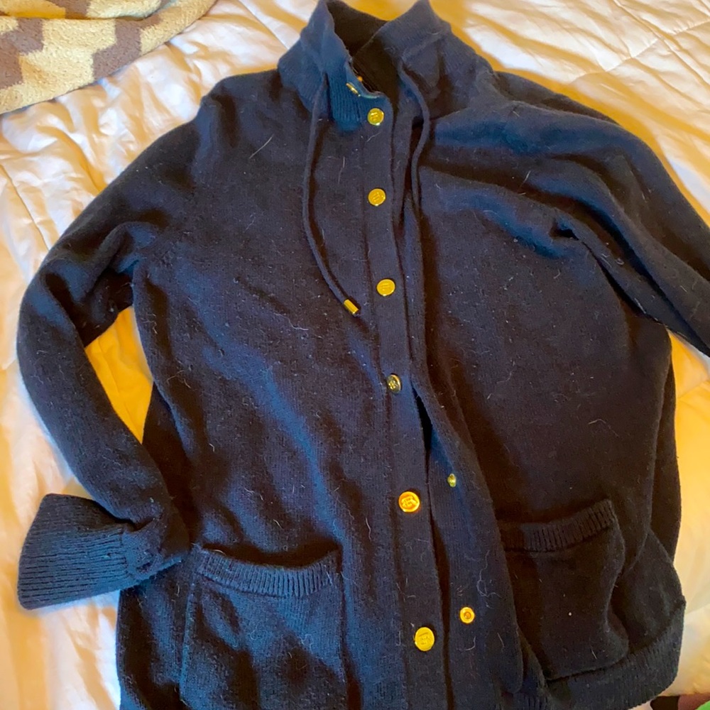 Dark blue sweater with gold snap buttons